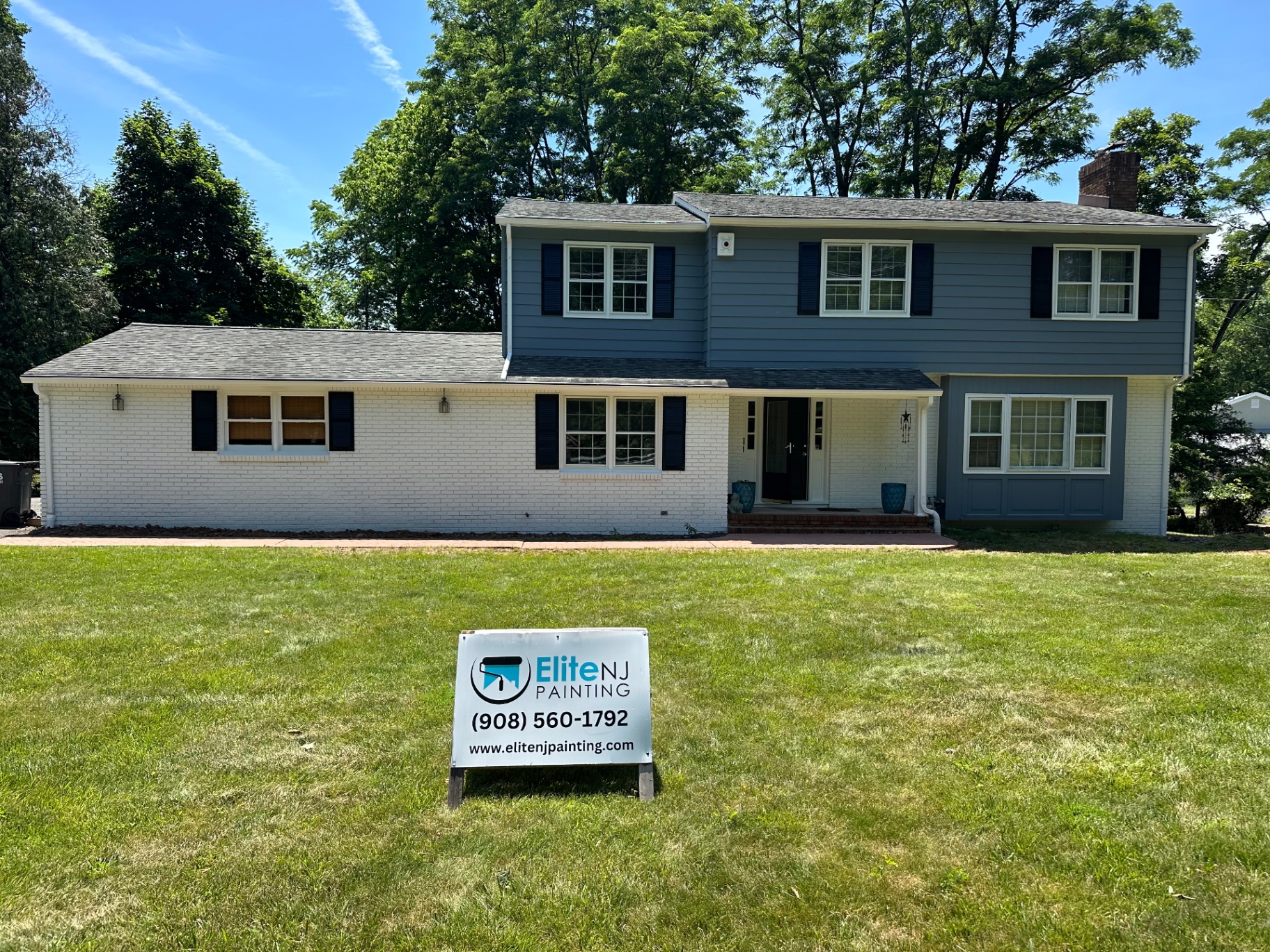 Elite NJ Painting yard sign in front of a freshly painted New Jersey home
