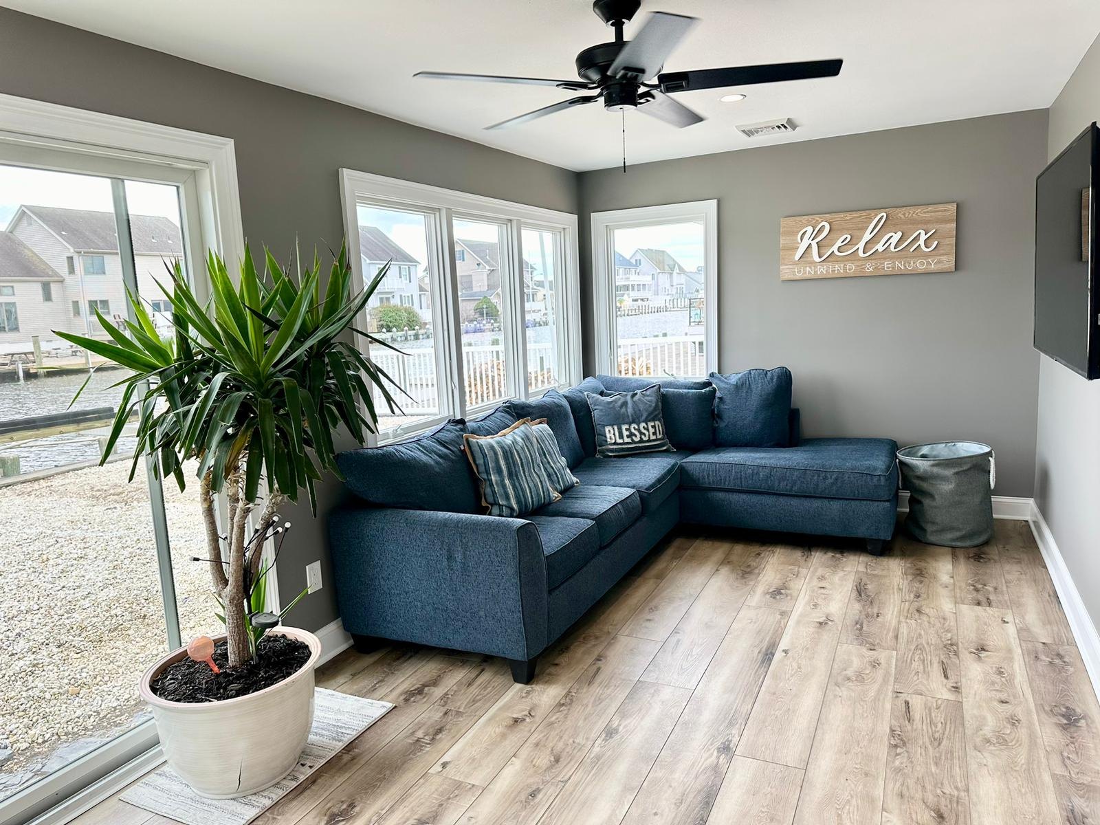 Freshly painted living room with light gray walls and white trim
